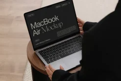 MacBook with Hands Mockup PSD
