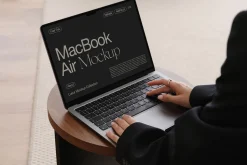 MacBook with Hands Mockup PSD